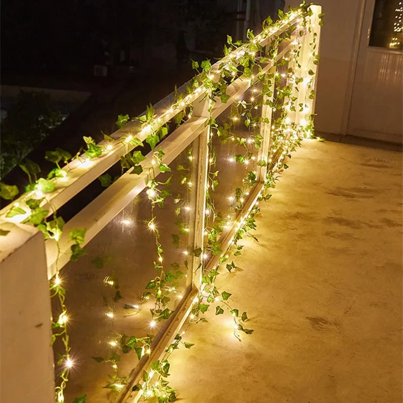 Ivy string lights elegantly decorating a balcony railing.